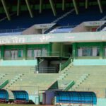 Emerging Luxury - a stadium with a row of empty bleachers