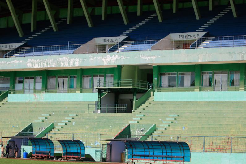 Emerging Luxury - a stadium with a row of empty bleachers