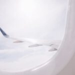 Packing Light - airplane flying over cloud during daytime