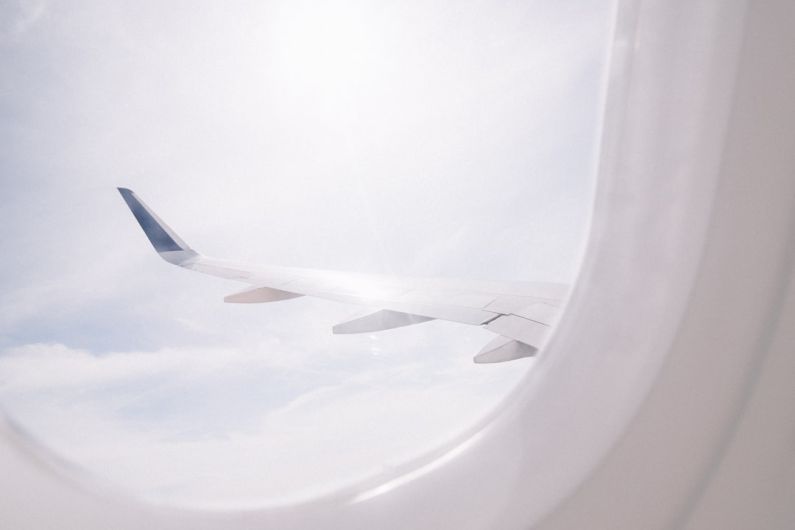 Packing Light - airplane flying over cloud during daytime