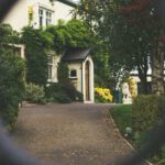 Luxury Packing - minimalist photography of house shot in front of chain fence