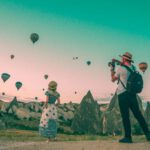 Toiletries Travel - man taking photo of hot air balloons
