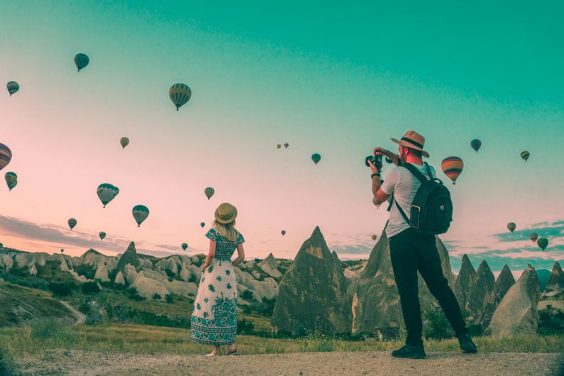 Toiletries Travel - man taking photo of hot air balloons