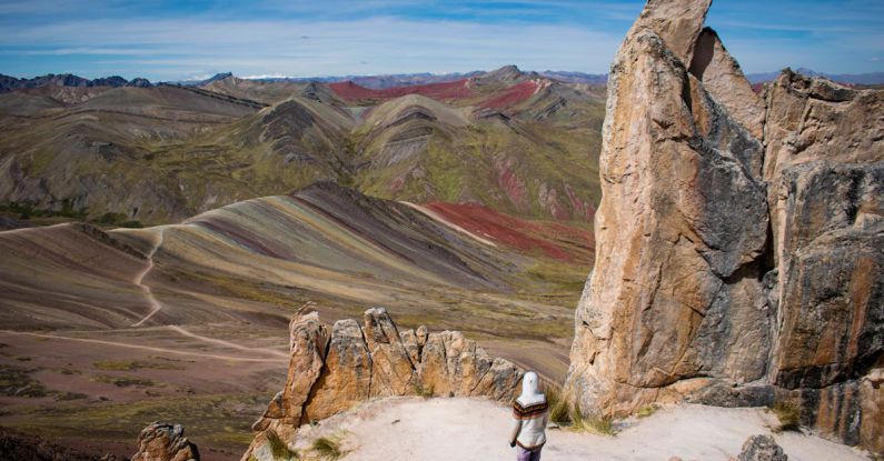 Self-discovery Travel - Person Standing among Arid, Barren Rocks