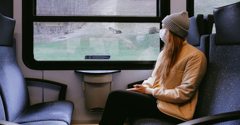 Travel Illness - Woman Wearing Mask on Train