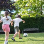 Kid-friendly Activities - Young Kids Playing Football on the Field
