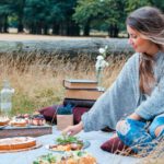 Nomad Family - woman sitting on picnic mat