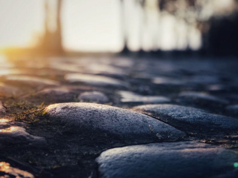 Cobblestone Street - a close up of rocks and grass on the ground