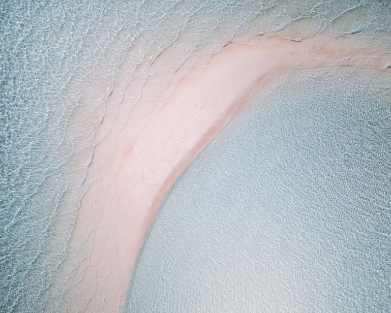 Secluded Island - white and pink textile with water