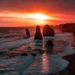 Outback Sunset - silhouette of stone on seashore during golden hour