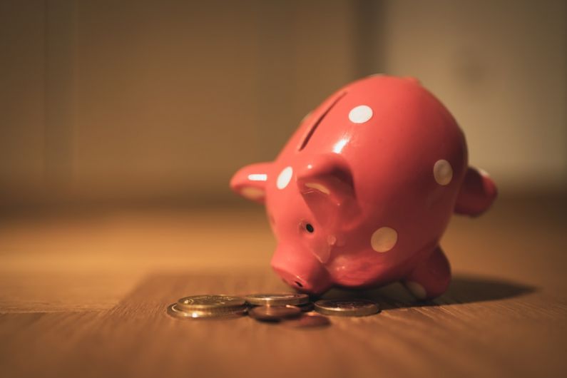 Piggy Bank - pink pig coin bank on brown wooden table