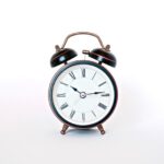 Alarm Clock - round black and white analog alarm clock