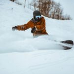 Snowboarding - photography of person playing snowboarding during daytime