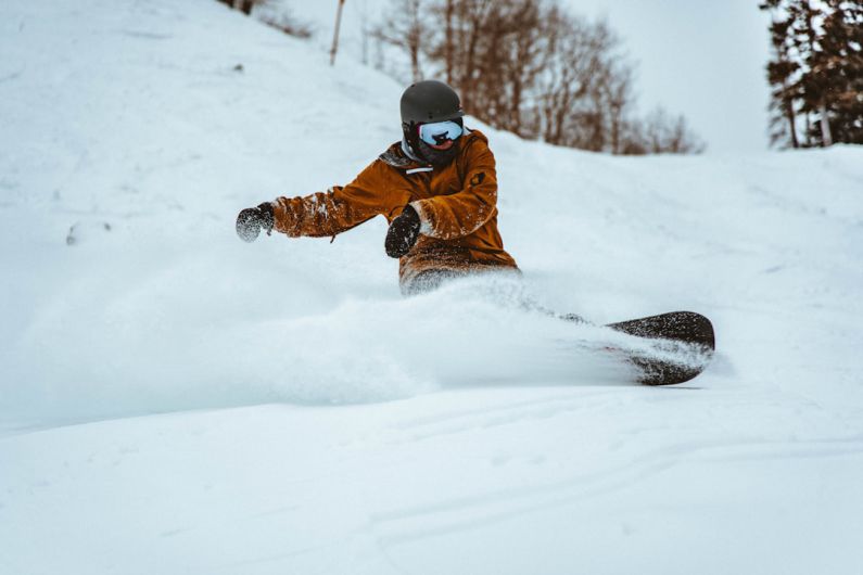 Snowboarding - photography of person playing snowboarding during daytime