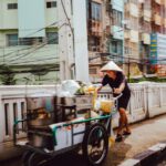 Thai Street Food - man pushing the cart on street