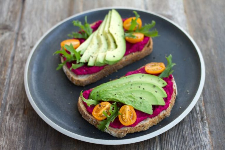 Hummus Plate - two sliced breads with avocado on top