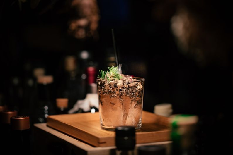 Tapas Bar - green plants inside clear glass plant pot